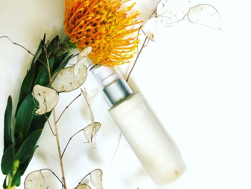 glass bottle moisturizer with flowers